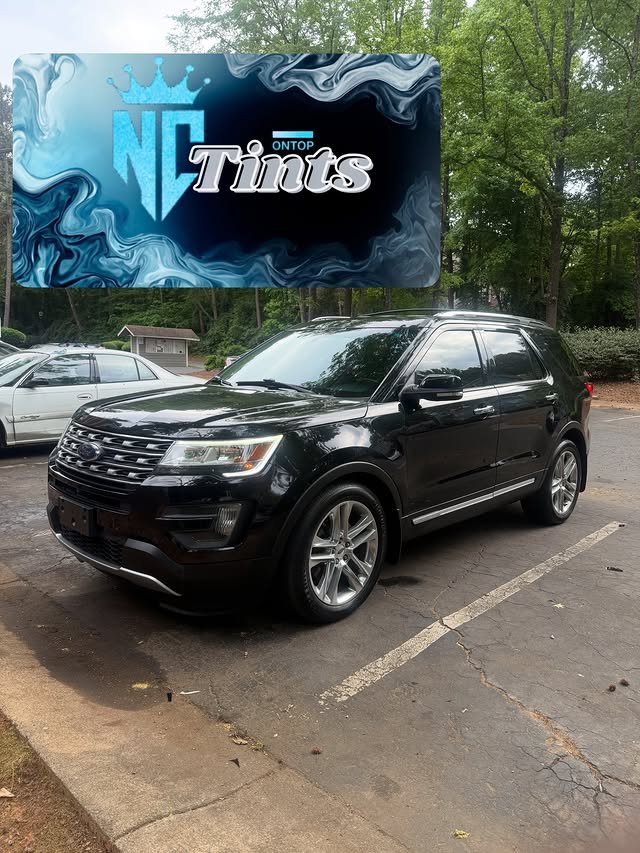 Black Ford Explorer with tinted windows