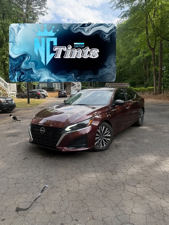 Maroon Nissan Altima with fresh window tint
