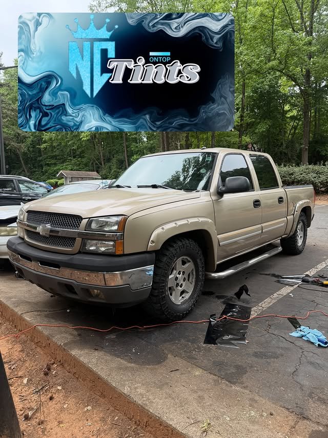 Tan Chevrolet Silverado during tint service